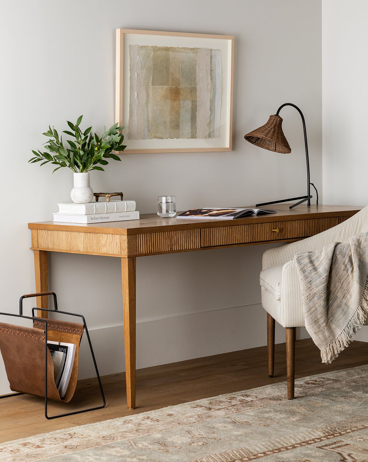 Pieter desk styled in a home office with a task lamp