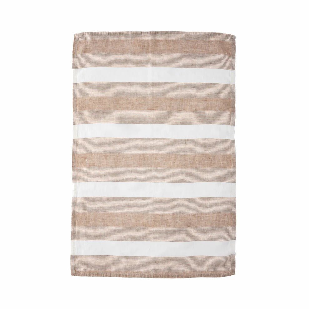 Striped rug with brown and white stripes on a white background