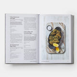 Calimia Home Portugal: The Cookbook open to a page featuring recipes for Cilarca mushrooms and fried truffles with eggs.