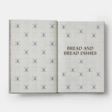 Calimia Home Portugal: The Cookbook open to a page titled Bread and Bread Dishes with blue tile pattern background.