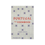 Calimia Home Portugal: The Cookbook featuring a white tile pattern cover with blue floral motifs and red lettering.
