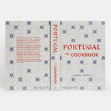 Calimia Home Portugal: The Cookbook featuring a white cover with blue tile patterns and red text.