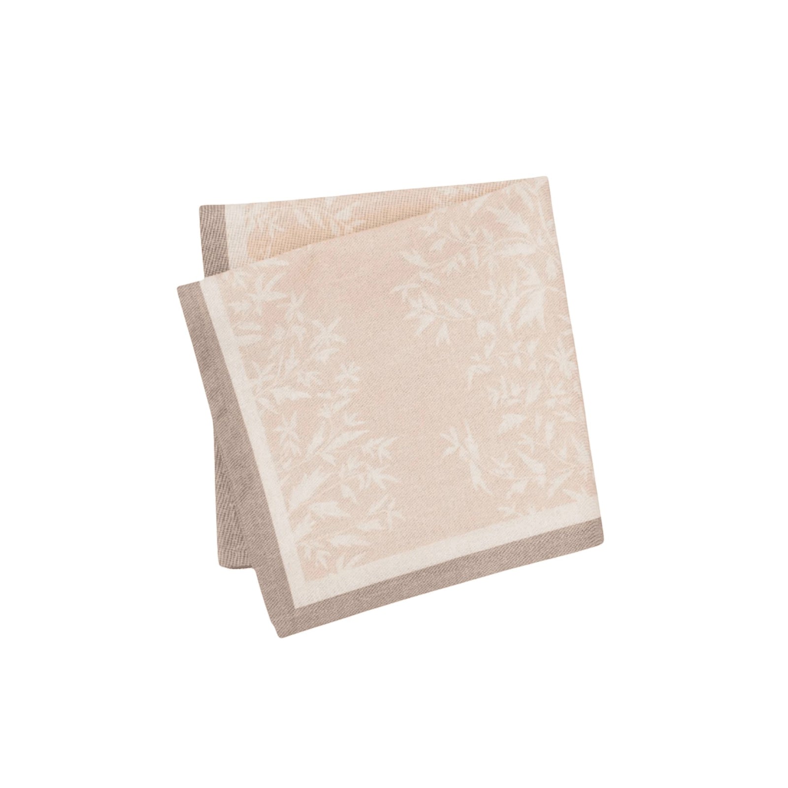 Maison Venu Primrose Sand napkins featuring a hand block-printed floral silhouette and a contrasting border trim.
