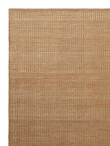 Armadillo Reed Rug in Natural, corner close-up of the jute with a wool weft pile and edge
