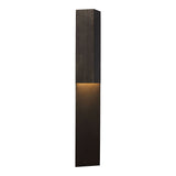 Rega Folded Sconce in Bronze, three-quarter view showing the angled fold and slim 3.25 inch profile