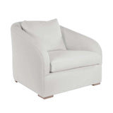Calimia Home Reily upholstered chair in white Belgian linen with a rounded back and light oak feet.