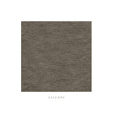 Calimia Home Calcaire fabric swatch in a textured, earthy grey-brown Belgian linen finish.