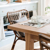 Retro Rattan Dining Arm Chair and Glenmore Woven Dining Chair at the oak kitchen table at Calimia Home