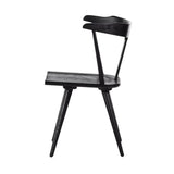 Calimia Home Ripley dining chair in matte black solid wood with a sculptural mid-century silhouette and tapered legs.