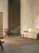 Armadillo River Rug in Natural & Indigo, handwoven jute rug shown in a room setting