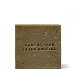 Back of the Flamingo Estate Rosemary & Parsley Soap Brick, embossed Made by Hand in Los Angeles.