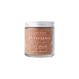 Calicutts Rotisserie spice blend in a small glass jar with a silver lid, featuring herbal and citrus notes.