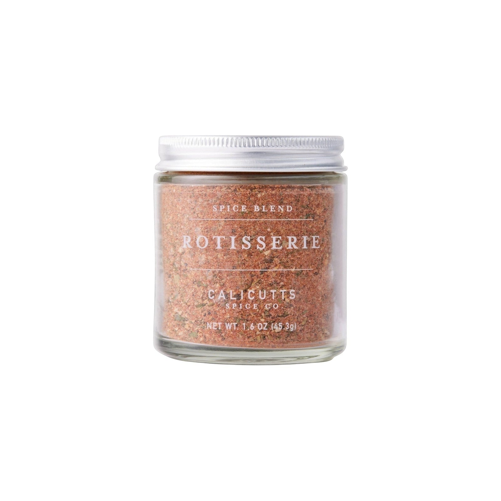 Calicutts Rotisserie spice blend in a small glass jar with a silver lid, featuring herbal and citrus notes.