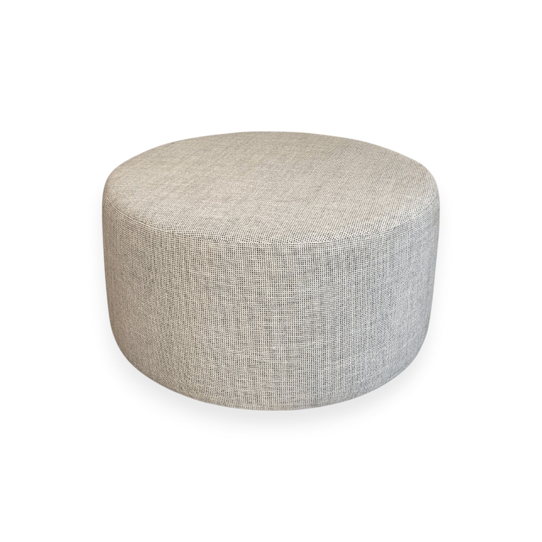 Calimia Home round ottoman upholstered in textured beige Belgian linen with a minimalist silhouette.