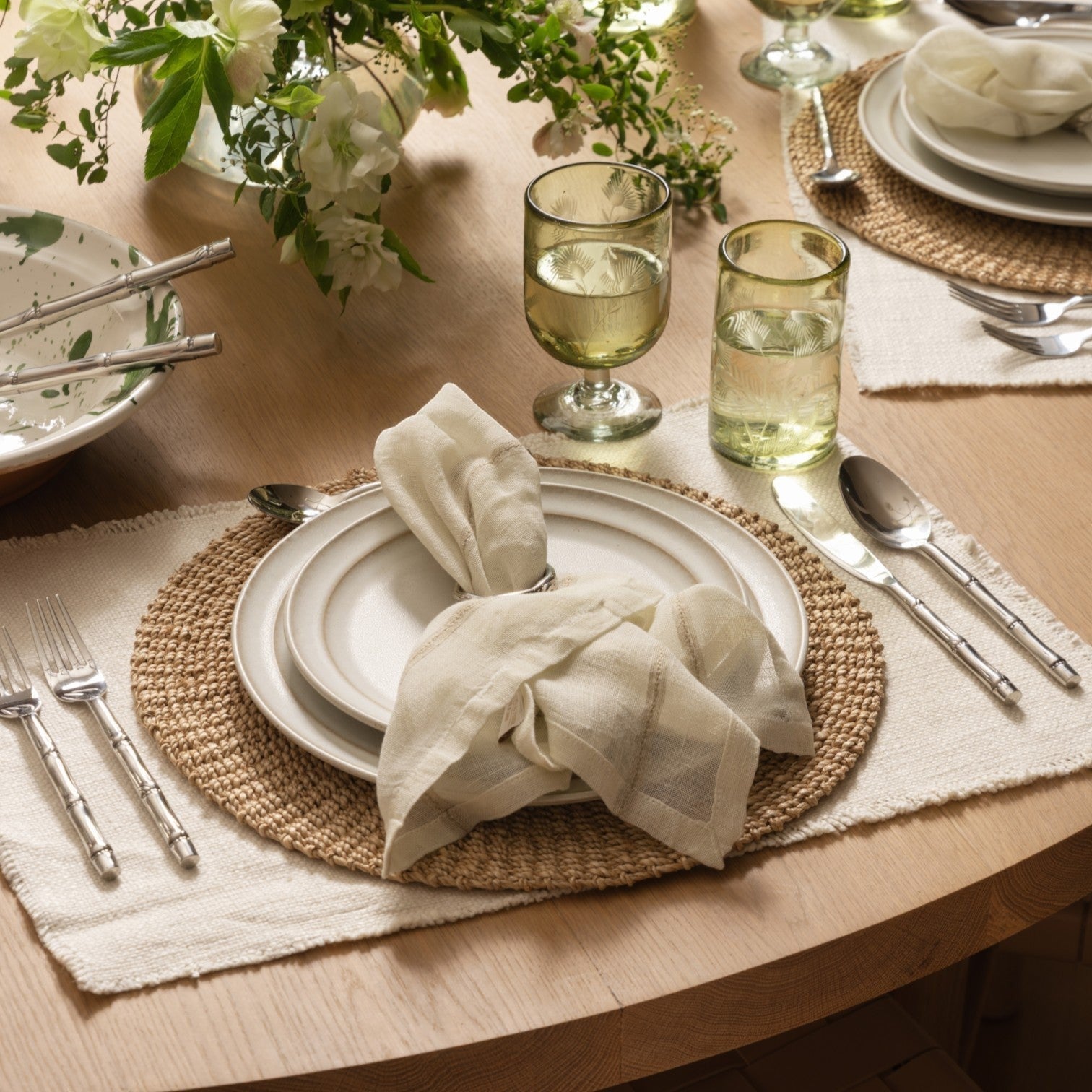 Calimia Home Rutherford natural linen napkins with subtle contrast-stitched stripes on a rustic table setting