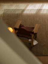 Sagrada Rug by Armadillo, hand-knotted wool cut pile rug, styled in a room at Calimia Home