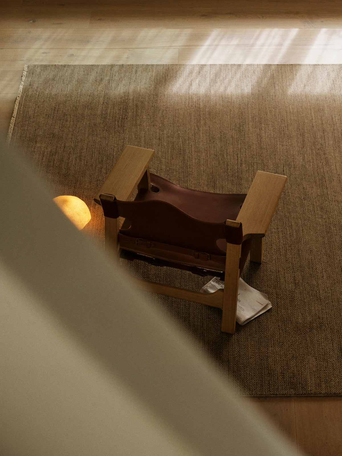 Sagrada Rug by Armadillo, hand-knotted wool cut pile rug, styled in a room at Calimia Home