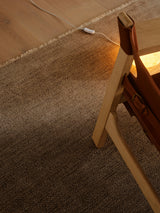Armadillo Sagrada Rug in Breccia, a second view of the hand-knotted wool cut pile rug in a styled interior
