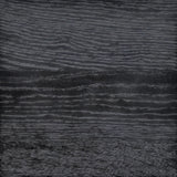 Close-up of the dark charcoal oak wood grain texture on a Calimia Home San Vincente Side Table.