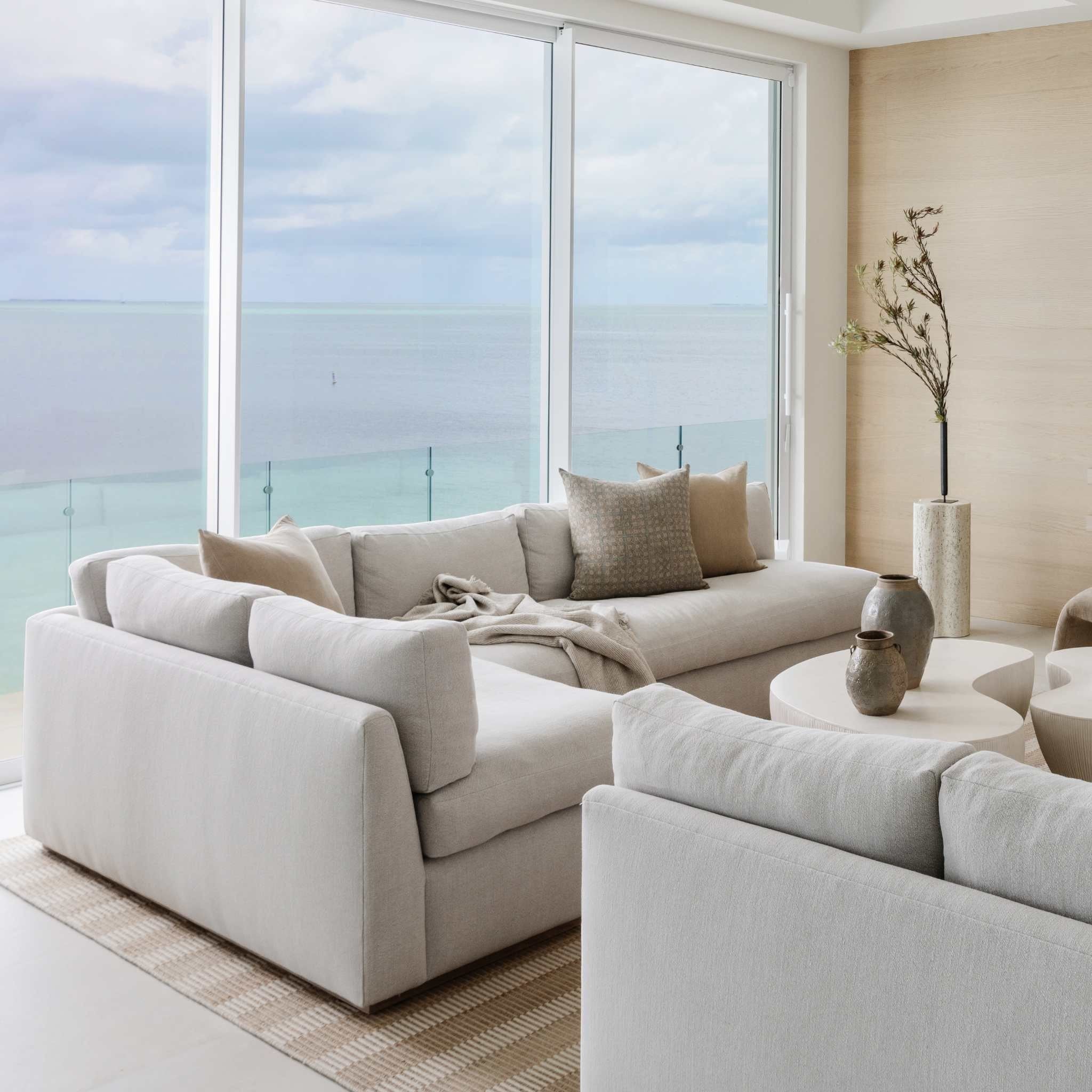 Sander Tan Pillow styled on a sofa — natural linen texture and warm tan tone in a living room setting