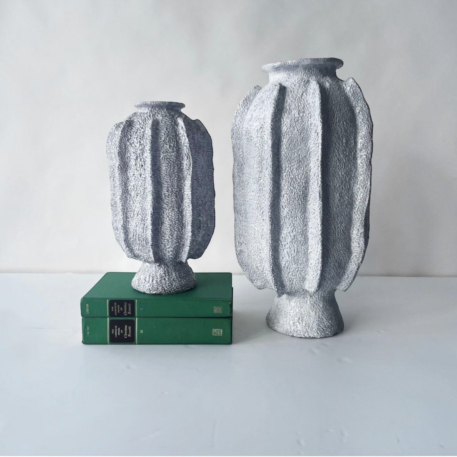 Calimia Home Sea Garden Prehistoire hand-formed terra-cotta vases with white textured glaze in two sizes