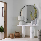 Calimia Home Sea Garden Prehistoire terra-cotta vases with white glaze displayed on a marble console table