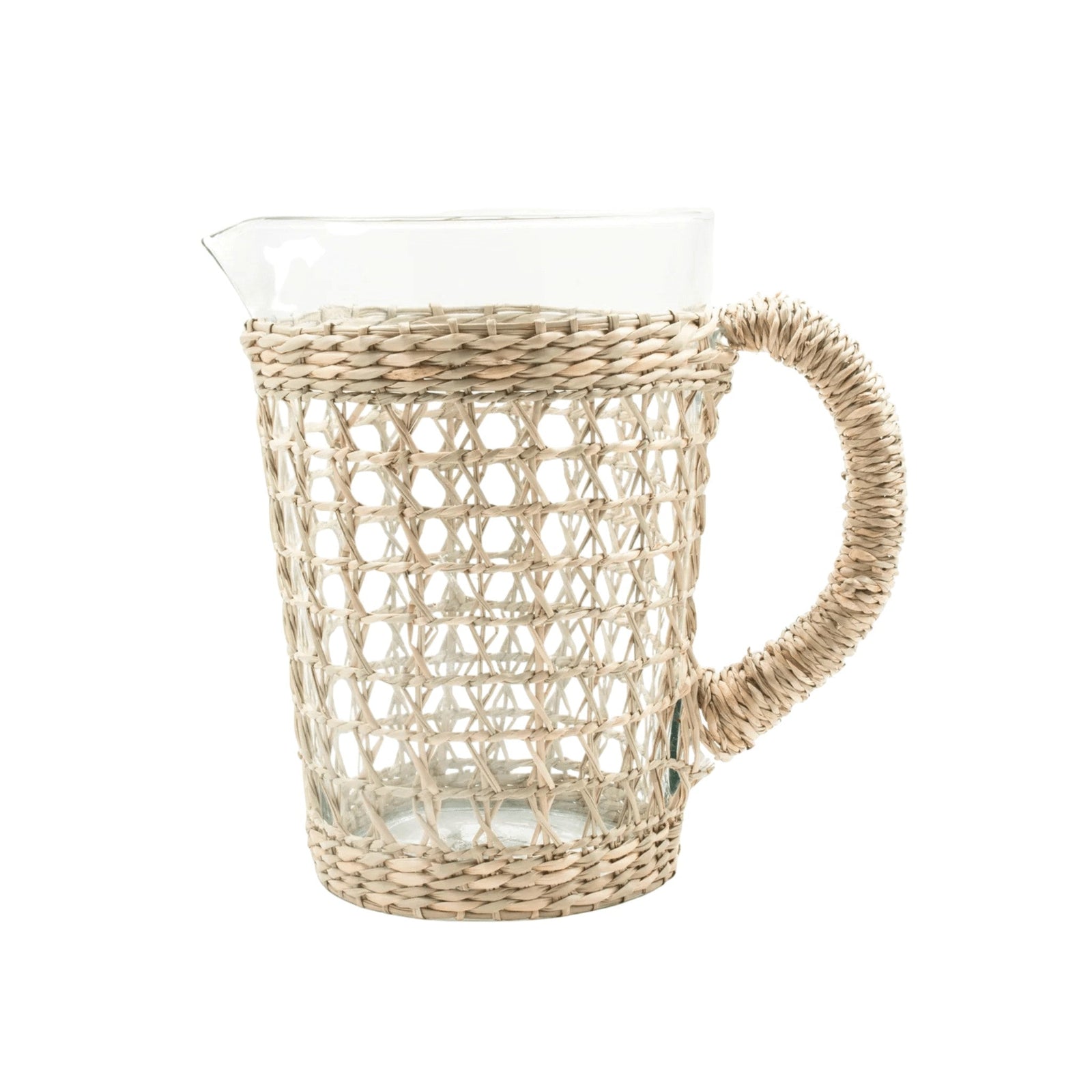 Be Home clear glass pitcher wrapped in handwoven natural seagrass with a sturdy woven handle and pour spout.
