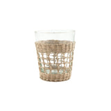 Calimia Home clear glass tumbler featuring a removable handwoven natural seagrass cage wrap for a coastal aesthetic.