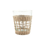 Calimia Home glass tumbler featuring a hand-woven natural seagrass cage sleeve for a coastal artisanal aesthetic.