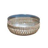 Be Home seagrass cage bowl featuring a clear glass insert with a hand-woven natural fiber exterior.