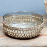Be Home seagrass cage bowl with a clear glass insert, featuring a hand-woven natural fiber design for rustic decor.
