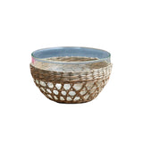 Be Home low bowl featuring a clear glass insert wrapped in a decorative handwoven natural seagrass cage design.