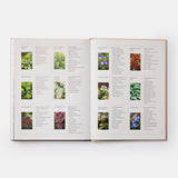 Calimia Home The Seasonal Gardener book open to a spread showing a directory of plant pairings with small photographs.