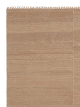 Armadillo Selva Rug in Desert, corner close-up of the afghan wool pile and edge
