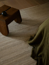 Armadillo Selva Rug in Oat, overhead view of the handwoven afghan wool kilim weave and edge finish