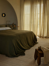 Armadillo Selva Rug in Oat, handwoven afghan wool kilim rug shown in a room setting