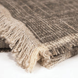 Calimia Home Serra Throw in mink brown, hand-woven from soft chenille yarn with a textured fringe edge.