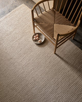 Armadillo Sherpa Rug in Sand, a second view of the handwoven wool blend rug in a styled interior