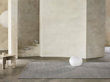 Armadillo Sherpa Rug in Pumice, a second view of the handwoven wool blend rug in a styled interior