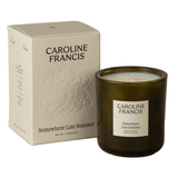 Caroline Francis candle and packaging on a beige background