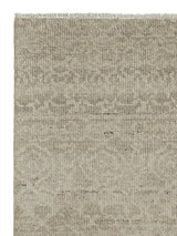 Armadillo Sonata Rug in Wisp, corner close-up of the hand-spun afghan wool pile and edge