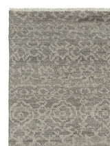 Armadillo Sonata Rug in Plume, corner close-up of the hand-spun afghan wool pile and edge