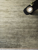 Armadillo Staccato Rug in Olivine, a second view of the hand-knotted silk and linen rug in a styled interior