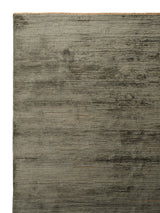 Armadillo Staccato Rug in Olivine, corner close-up of the silk, linen, and cotton pile and edge