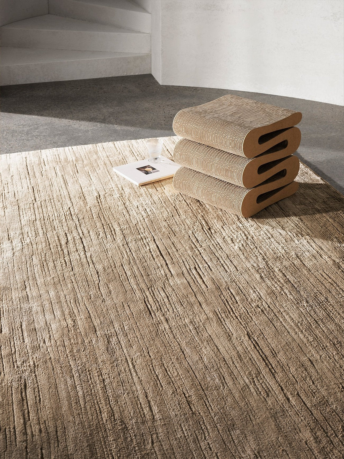 Armadillo Staccato Rug in Latte, hand-knotted silk and linen rug shown in a room setting