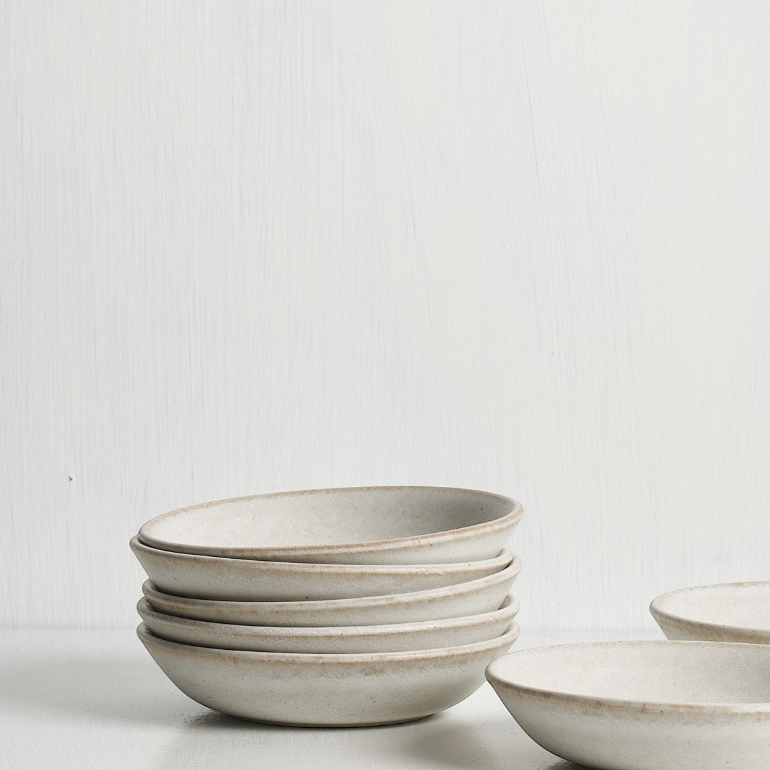 Standard Affair Snack Bowl in oat glaze, side view