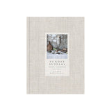 Calimia Home Sunday Suppers cookbook with a beige linen-bound cover and a rustic food photography inset.