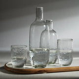 Tabou hammered tumbler styled with cocktail on wooden tray