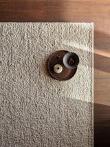 Armadillo Tempest Rug in Tundra, a second view of the handcrafted undyed new zealand wool rug in a styled interior