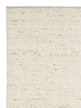 Armadillo Tempest Rug in Tundra, corner close-up of the undyed new zealand wool pile and edge
